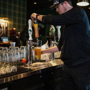 Bartender getting beer at X-Golf
